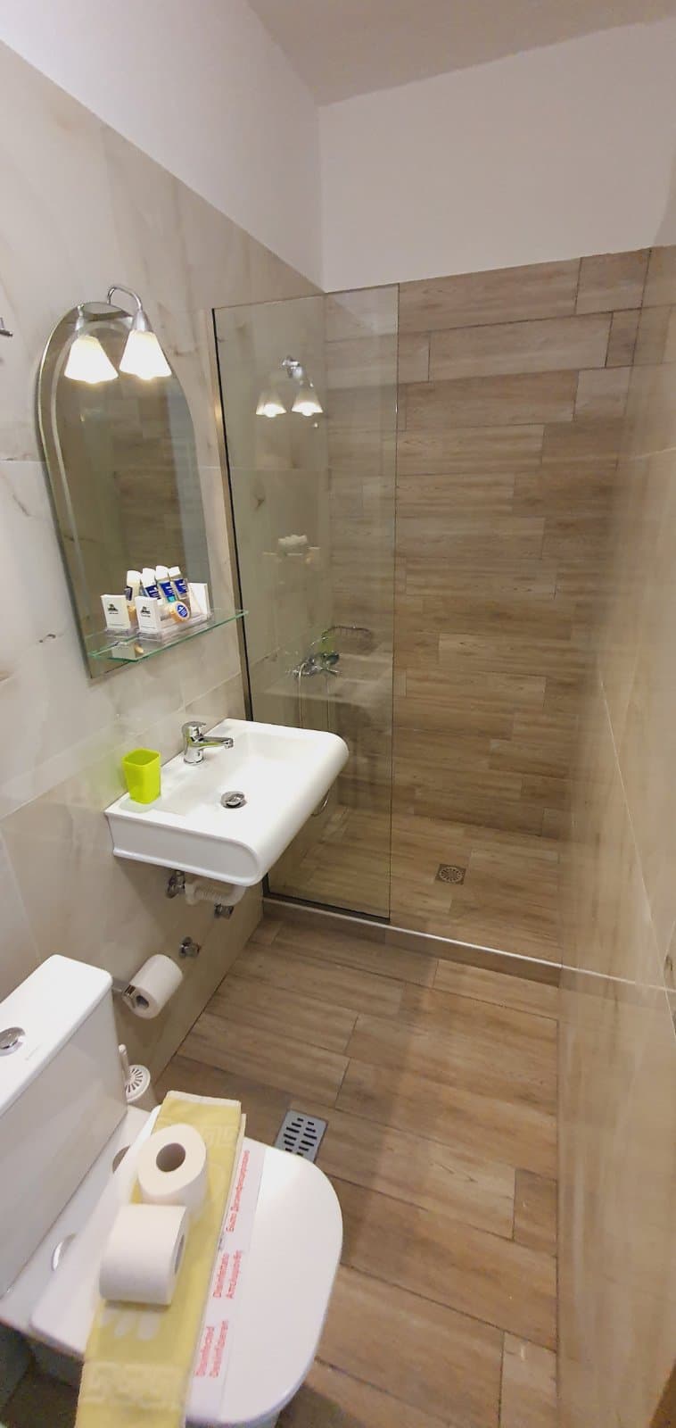 Corner of a guest room with the balcony door open