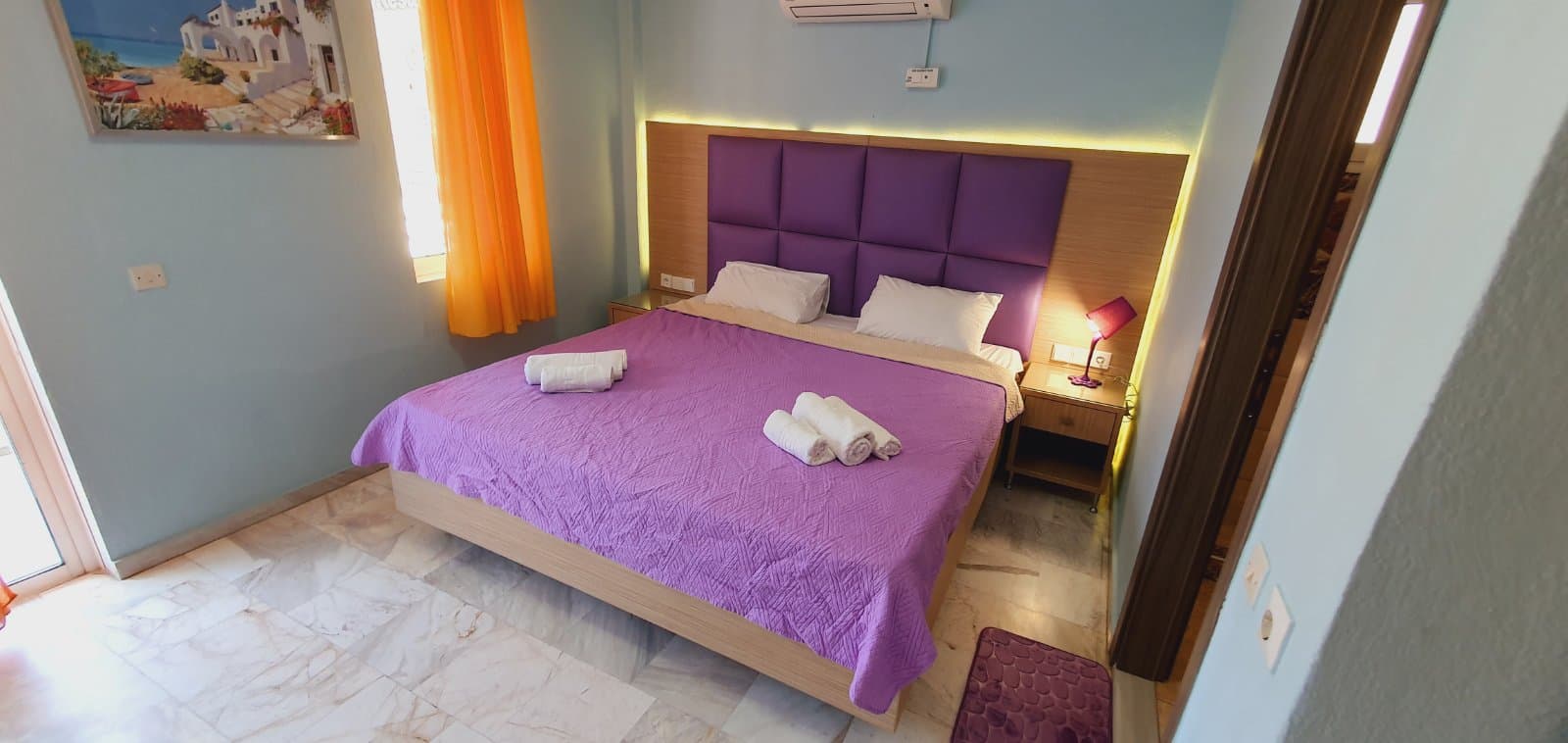 Bed, bedside table and reading lamp