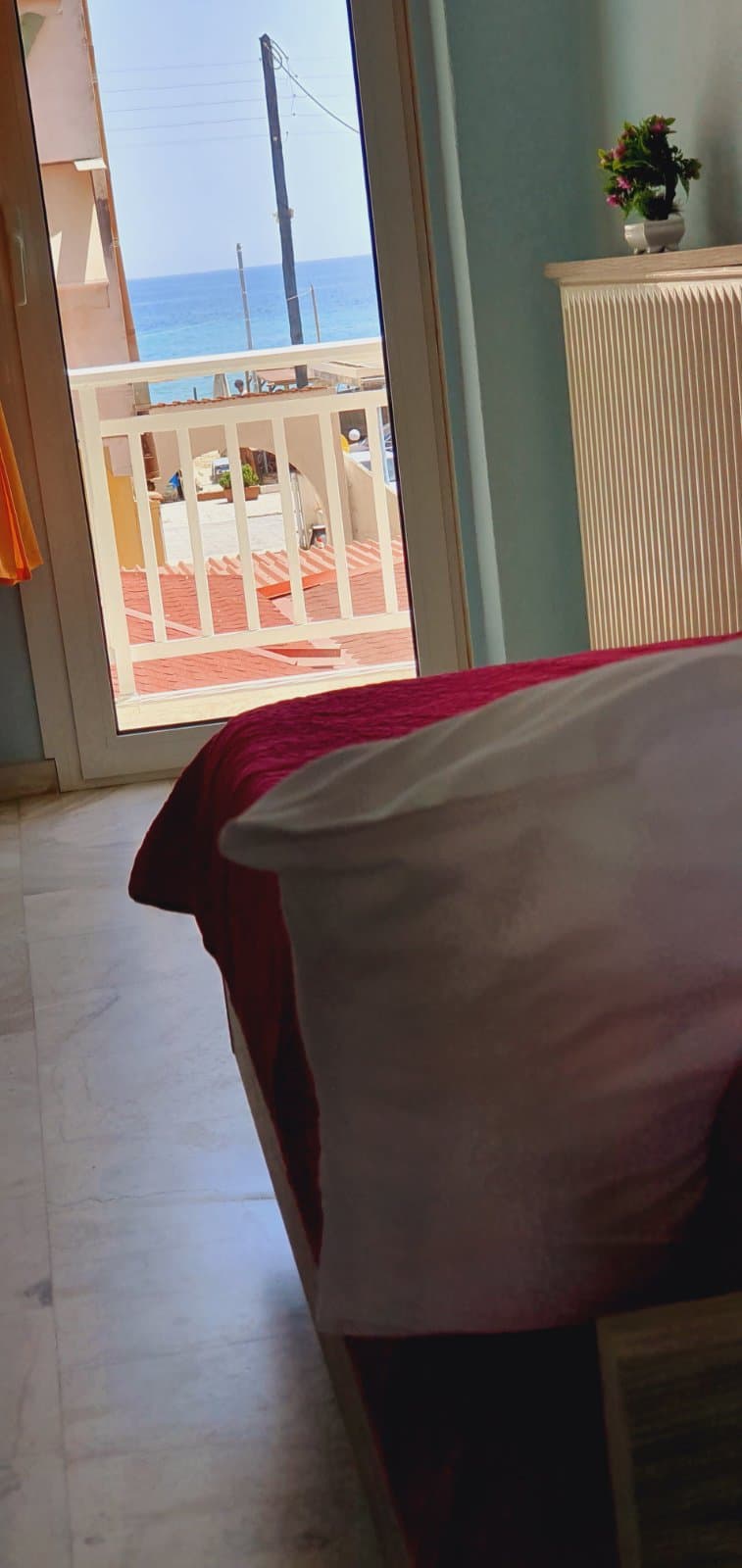 Guest room with fresh linen and folded towels